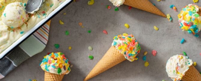 Fruity pebbles cereal no-churn ice cream cones sitting on a