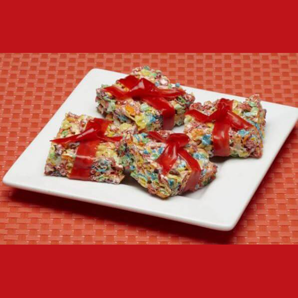 Pebbles squares on a white plate with a red background.