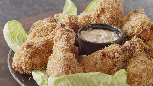 BBQ Chicken with Sour Cream on a plate with lettuce.