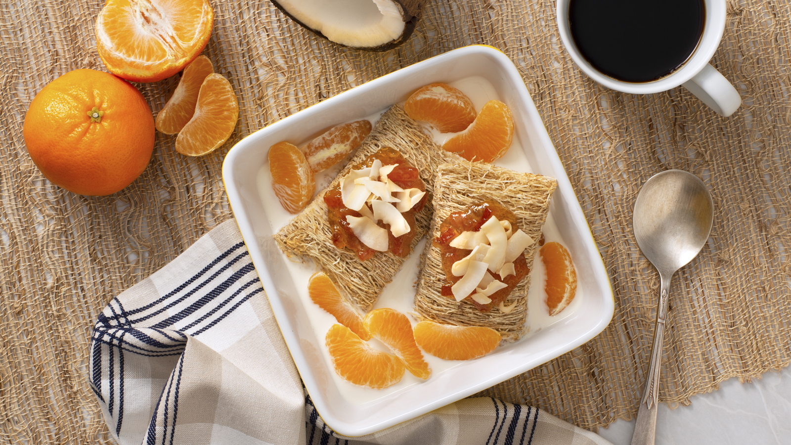 Shredded Wheat Get Coconutty breakfast bowl with mandarin oranges and coconut shavings on top.