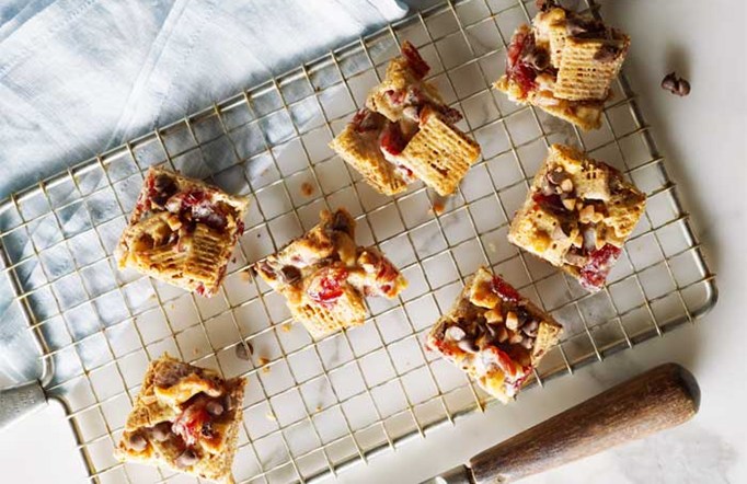 Shreddies Chocolate Fruit & Nut Teasers cut into squares on a wire cooling rack.