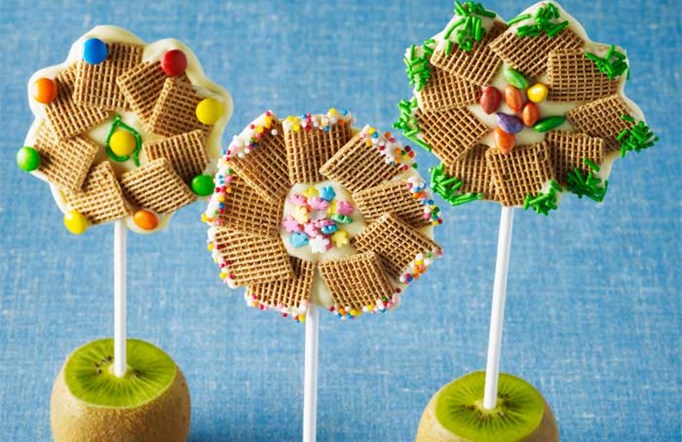 Three Shreddies Chocolate Flower Pops on a blue background.