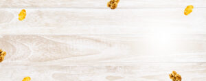 Woodgrain background with random pieces of cereal