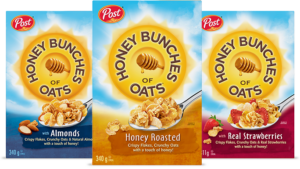 Three Boxes of Cereal. Honey Bunches of Oats with Almonds, Honey Roasted and with Strawberries.