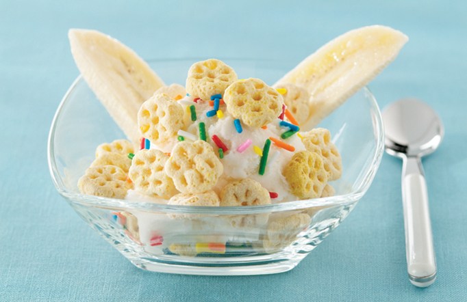 Honeycomb Lickety-Split Crunch in a clear bowl with a spoon on the side.