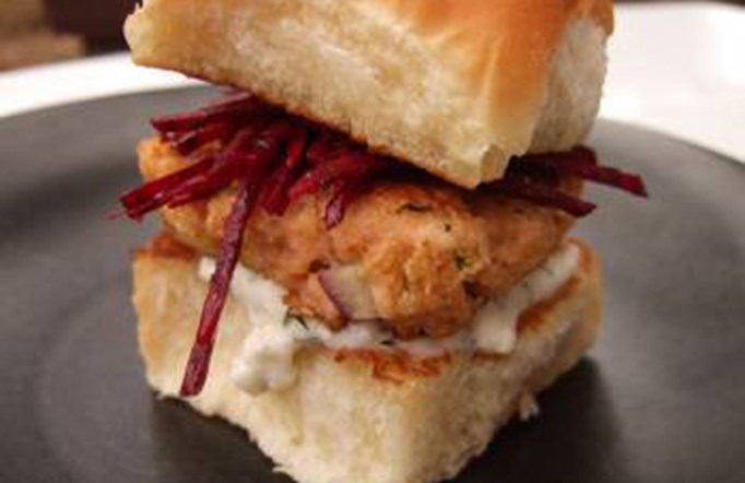 Post Shredded Wheat Salmon Sliders with Fresh Beet Slaw on a black plate.