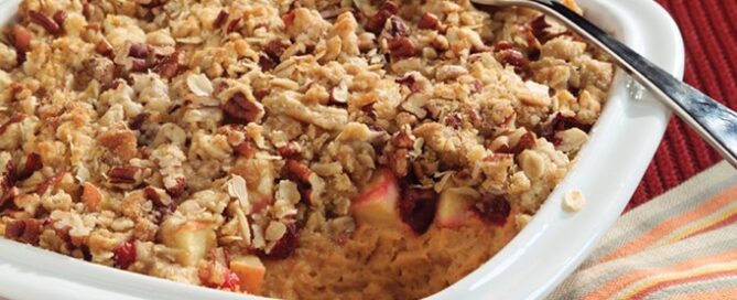 Sweet Potato Crisp in a white casserole dish.