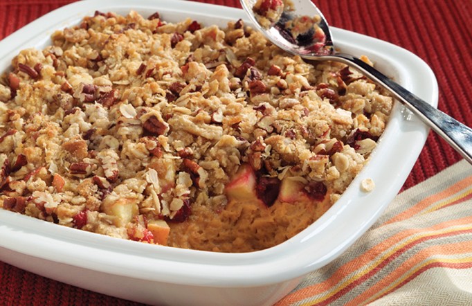 Sweet Potato Crisp in a white casserole dish.